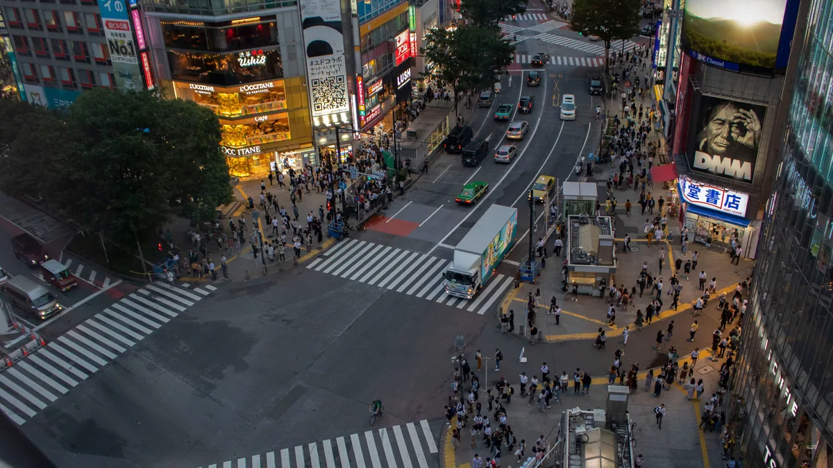 Traveller checking maps on the best eSIM Japan data plan in Tokyo